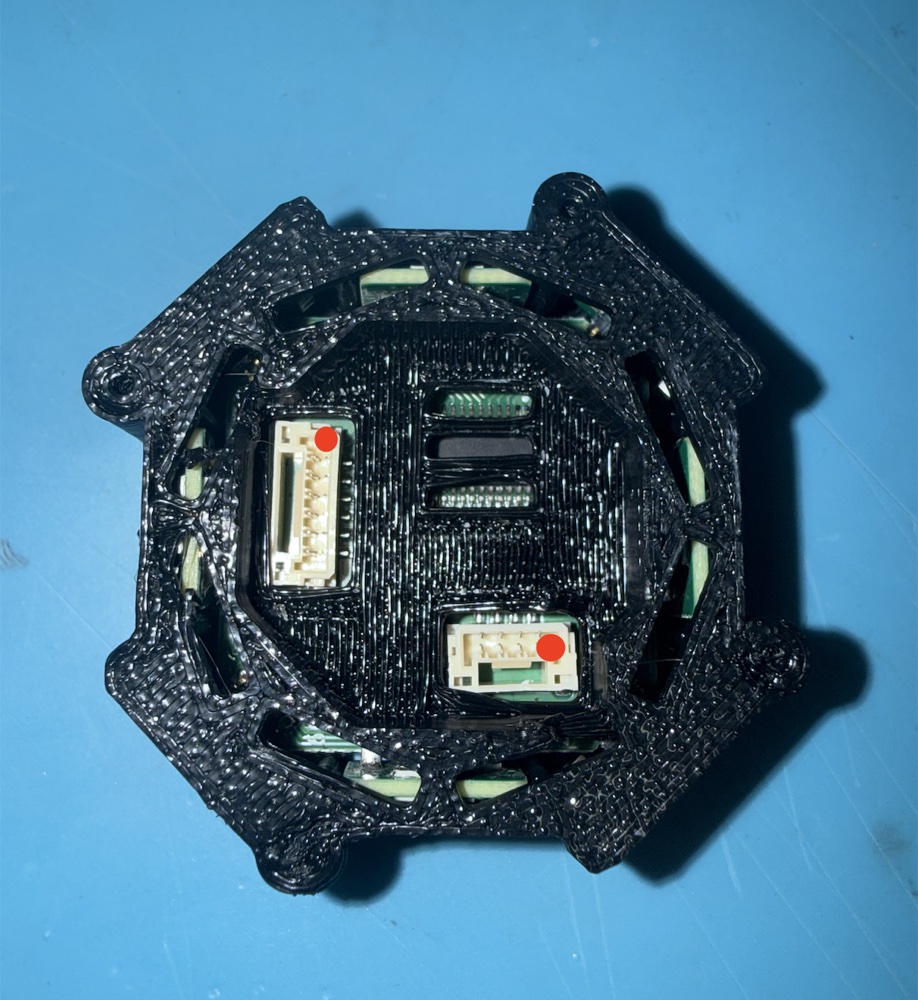 Underside of the assembled unit showing J6 (6-pin, upper left) and J5 (4-pin, lower right), each with its supply pin marked in red